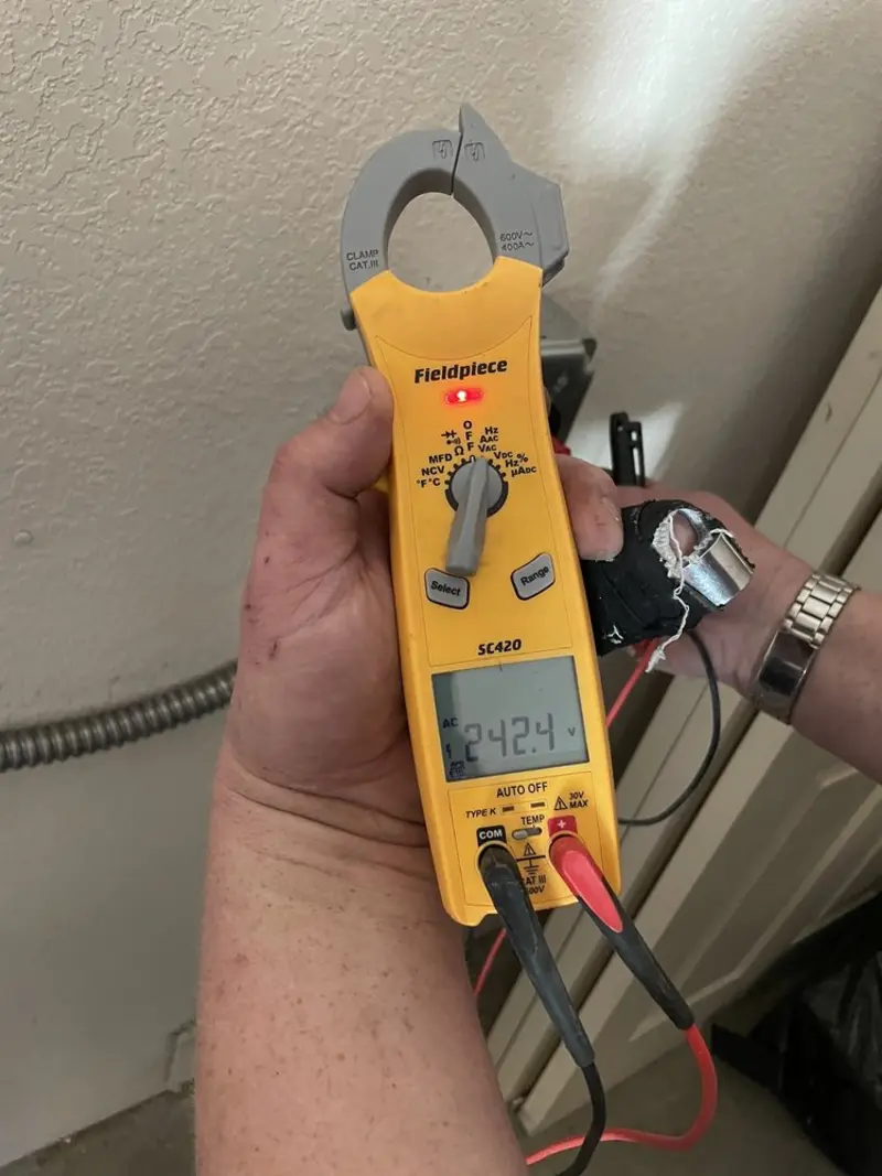 Voltage testing with clamp meter during Recessed Lighting Installation in Moberly